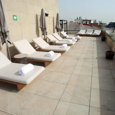 Hotel terrace with sun loungers on large-format Access Safety flooring